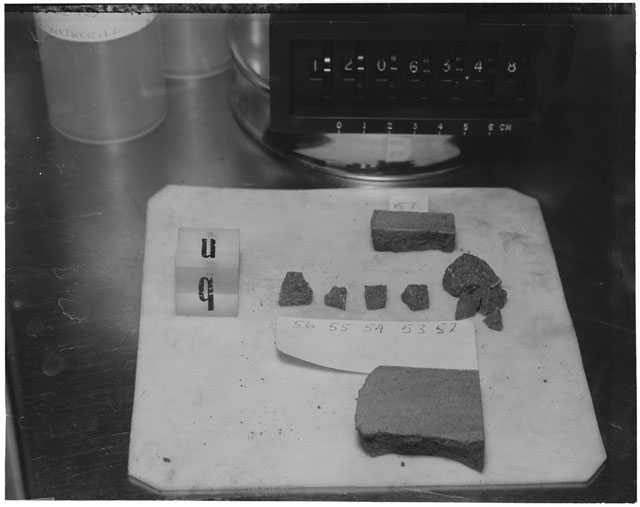 Black and white photograph of Apollo 12 Sample(S) 12063,52-57; Processing photograph displaying a post chip group with an orientation of B,N.