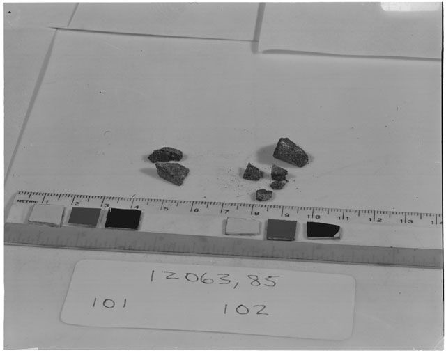 Black and white photograph of Apollo 12 Sample(S) 12063,85,101,102; Processing photograph displaying chip group.