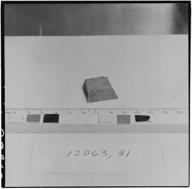 Black and white photograph of Apollo 12 Sample(S) 12063,81; Processing photograph displaying chip.