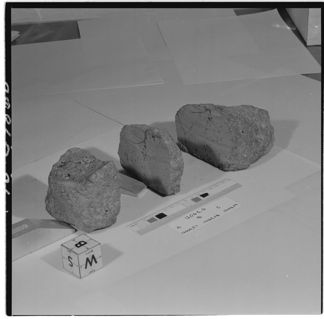 Black and white photograph of Apollo 12 Sample(S) 12063,0,27-29; Processing photograph displaying a reconstruction sample with an orientation of B,S,W.