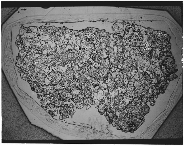 Black and white Thin Section photograph of Apollo 12 Sample(s) 12040,43 using transmitted light.
