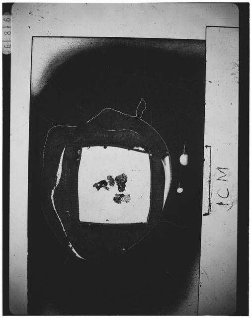 Black and white photograph of Apollo 12 sample 12030,21; Thin Section photograph displaying grain mount.
