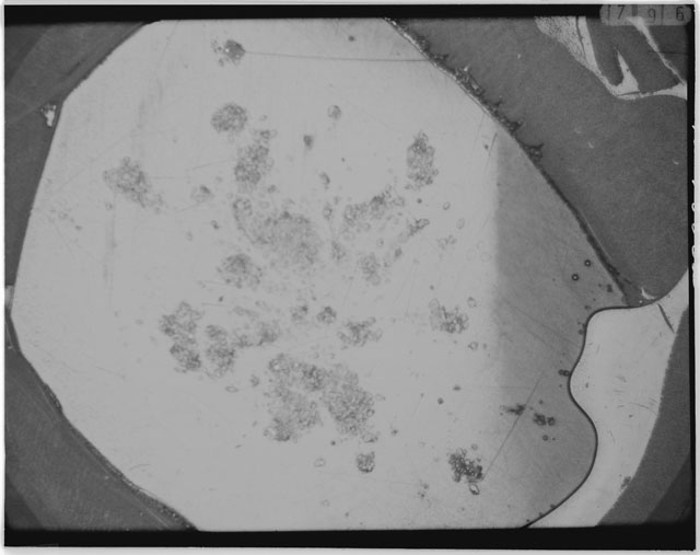 Black and white photograph of Apollo 12 sample 12030,28; Thin Section photograph displaying grain mount.