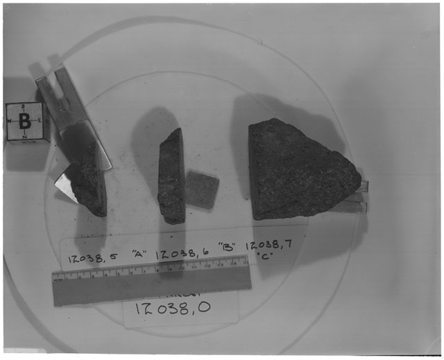 Black and white photograph of Apollo 12 Sample(S) 12038,5-7; Processing photograph displaying a post cut sample with an orientation of B.