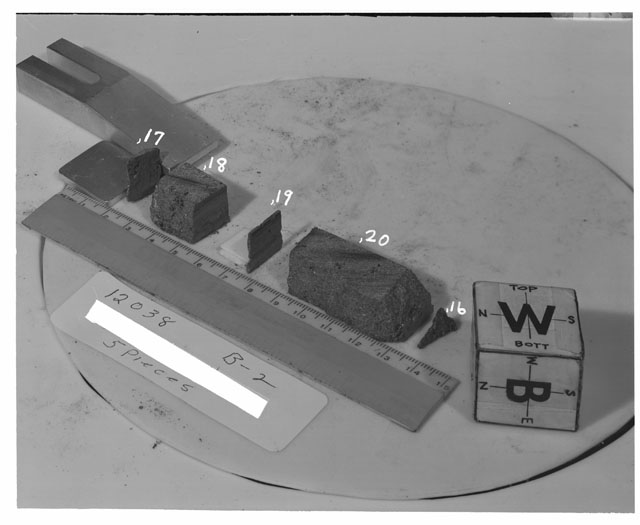 Black and white photograph of Apollo 12 Sample(S) 12038,16-20; Processing photograph displaying a post cut sample with an orientation of W,B.
