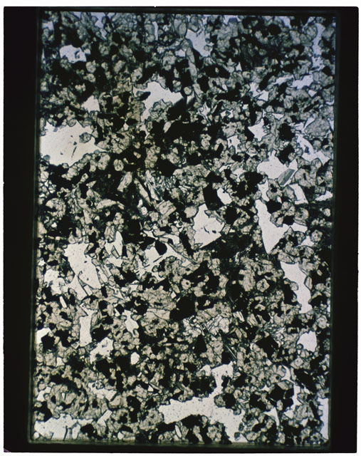 Color photograph of Apollo 11 Sample(s) 10017,61; Thin Section G photograph using transmitted light.