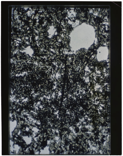 Color photograph of Apollo 11 Sample(s) 10069; Thin Section A photograph using transmitted light.