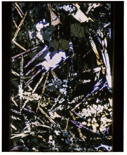 Color Thin Section photograph of Apollo 12 Sample(s) 12009,15 using cross nichols light.
