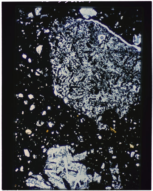 Color photograph of Apollo 11 Sample(s) 10046; Thin Section H photograph using cross nichols light.
