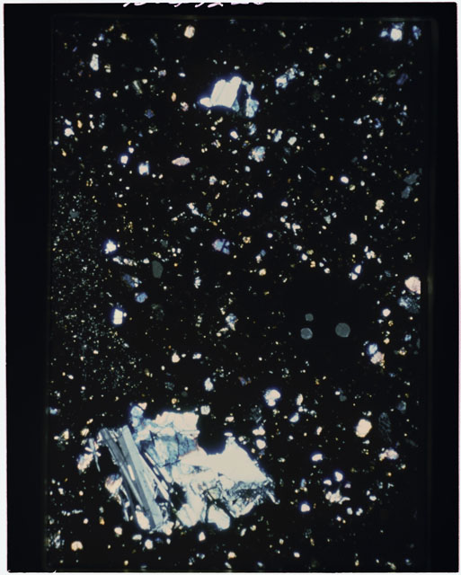 Color photograph of Apollo 11 Sample(s) 10021,31; Thin Section using transmitted light.