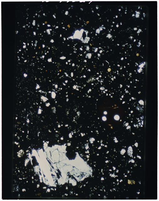 Color photograph of Apollo 11 Sample(s) 10021,31; Thin Section using cross nichols light.