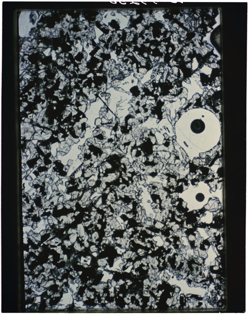 Color photograph of Apollo 11 Sample(s) 10017,20; Thin Section photograph using transmitted light.
