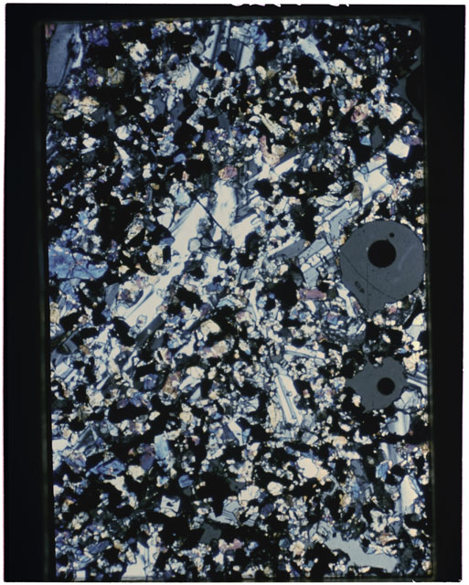 Color photograph of Apollo 11 Sample(s) 10017,20; Thin Section photograph using cross nichols light.