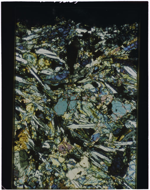 Color Thin Section photograph of Apollo 12 Sample(s) 12002,165 using cross nichols light.