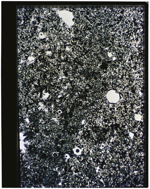 Color photograph of Apollo 11 Sample(s) 10049,21; Thin Section photograph using transmitted light.
