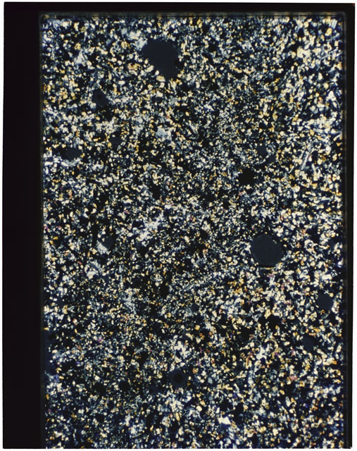 Color photograph of Apollo 11 Sample(s) 10049,21; Thin Section photograph using cross nichols light.