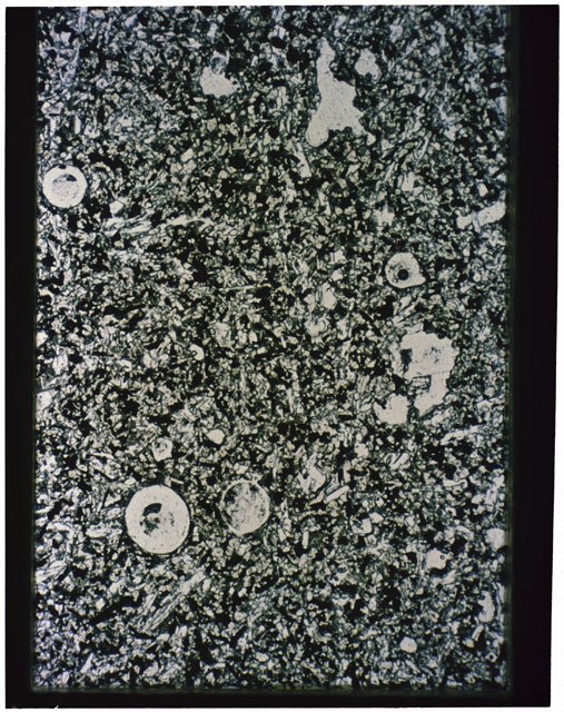 Color photograph of Apollo 11 Sample(s) 10049,22; Thin Section a photograph using transmitted light.