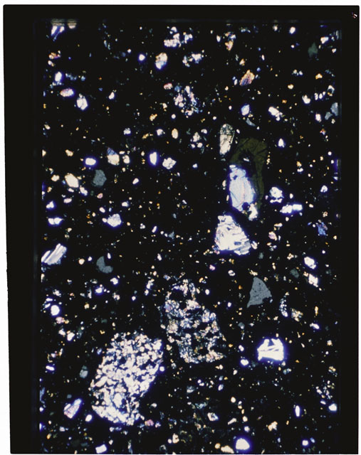 Color photograph of Apollo 11 Sample(s) 10021,30; Thin Section using cross nichols light.