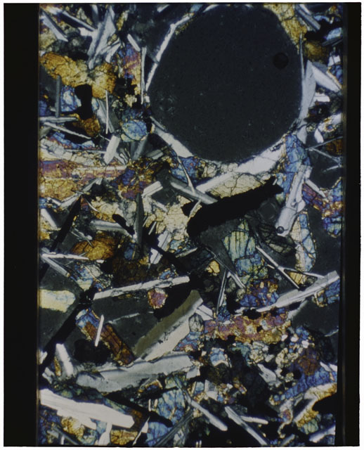 Color Thin Section photograph of Apollo 12 Sample(s) 12047,10 using cross nichols light.