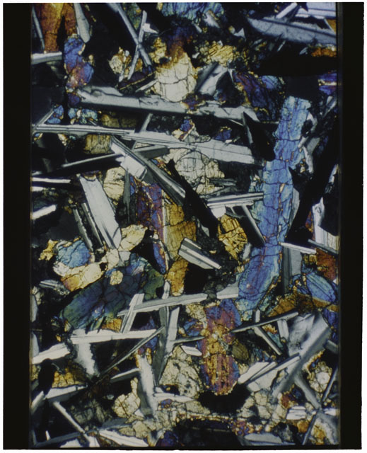 Color Thin Section photograph of Apollo 12 Sample(s) 12051,57 using cross nichols light.