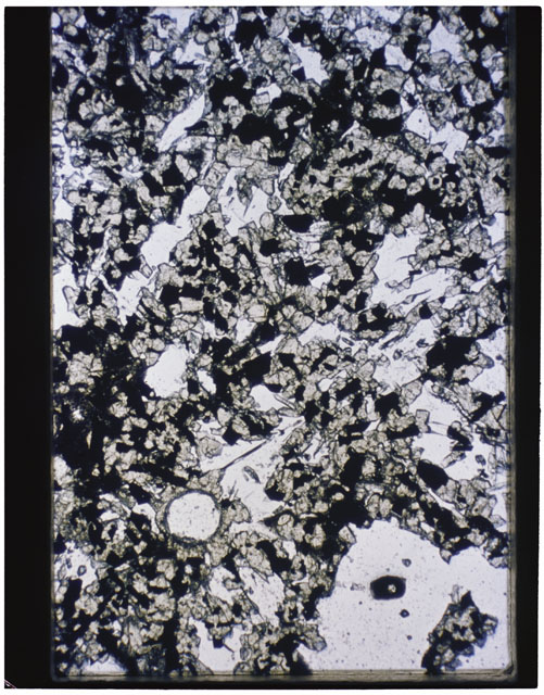 Color photograph of Apollo 11 Sample(s) 10017,62; Thin Section photograph using transmitted light.