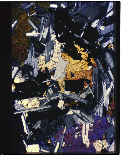 Color photograph of Apollo 11 Sample(s) 10058,33; Thin Section photograph using cross nichols light.