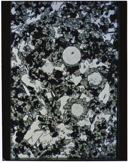 Color photograph of Apollo 11 Sample(s) 10017,59; Thin Section photograph using transmitted light.