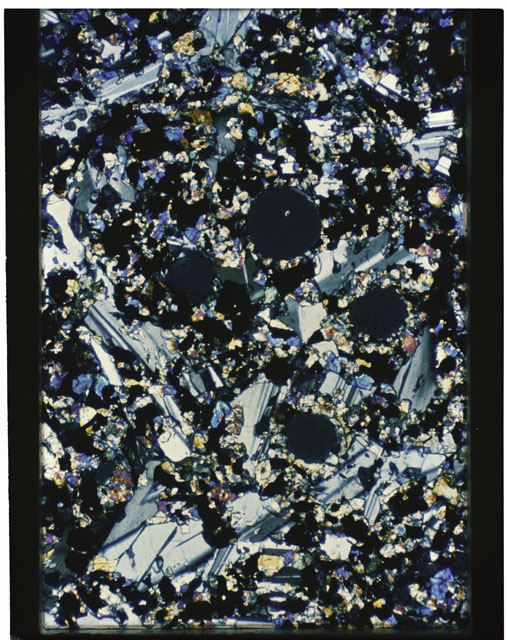 Color photograph of Apollo 11 Sample(s) 10017,59; Thin Section photograph using cross nichols light.