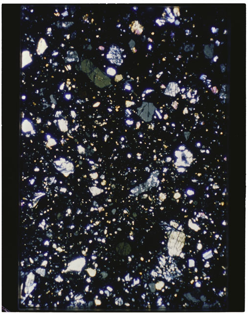 Color photograph of Apollo 11 Sample(s) 10019; Thin Section photograph using cross nichols light.