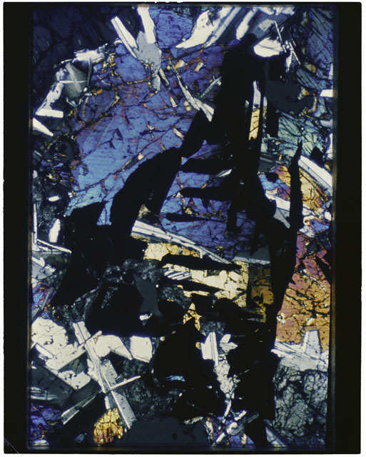 Color photograph of Apollo 11 Sample(s) 10044; Thin Section F' photograph using cross nichols light.