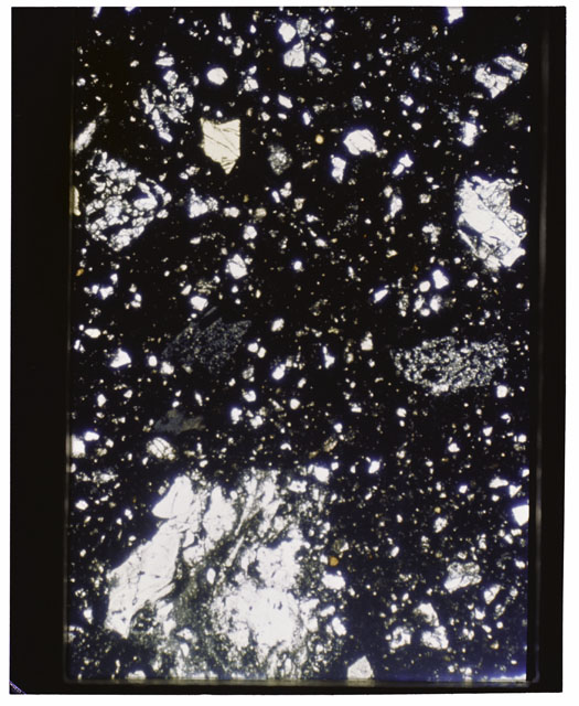 Color photograph of Apollo 11 Sample(s) 10019,17; Thin Section photograph using transmitted light.