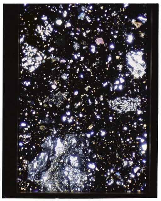 Color photograph of Apollo 11 Sample(s) 10019,17; Thin Section photograph using cross nichols light.