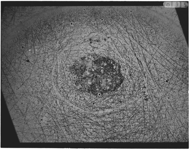 Black and white photograph of Apollo 12 sample 12033,90; Thin Section photograph displaying grain mount.