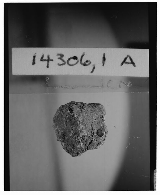 Black and white photograph of Apollo 14 Sample(s) 14306,1A; Processing photograph displaying a chip.