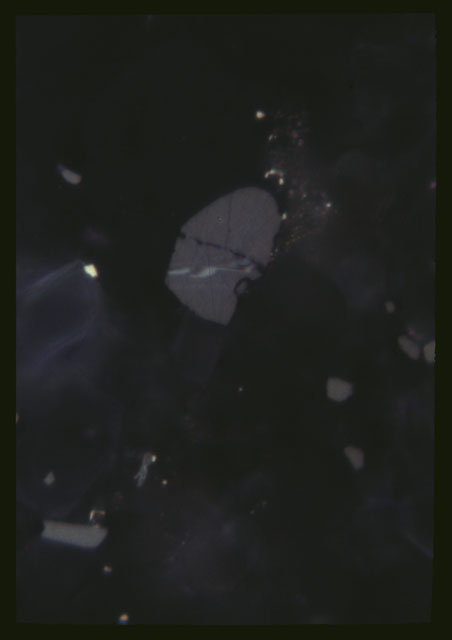 Color Thin Section photograph of Apollo 14 Sample(s) 14308,4 using transmitted light at 100x magnification.