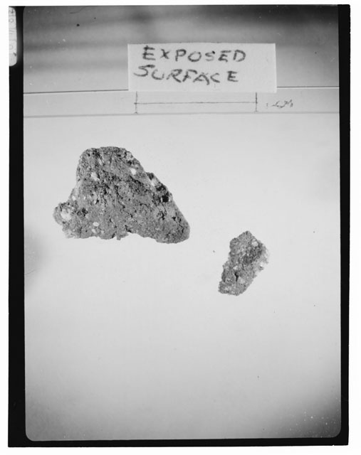 Black and white photograph of Apollo 14 Sample(s) 14313,3; Processing photograph displaying the exposed surface of a chip.