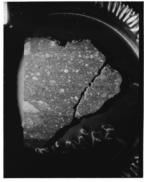 Black and white photograph of Apollo 14 Sample(s) 14307,23; Processing photograph displaying a slab.