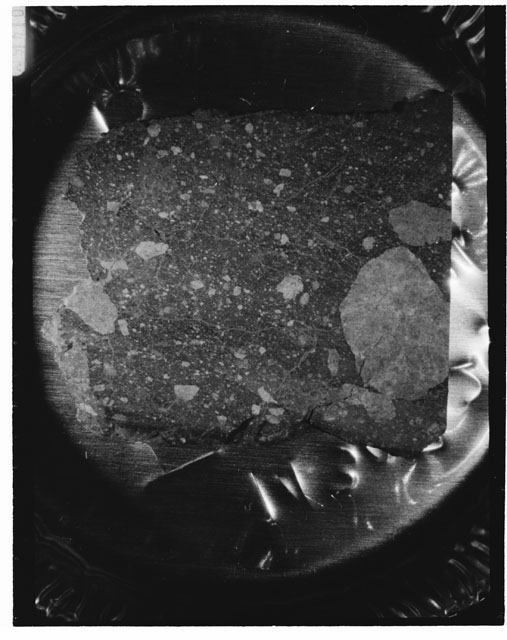 Black and white photograph of Apollo 14 Sample(s) 14307,25; Processing photograph displaying a slab.
