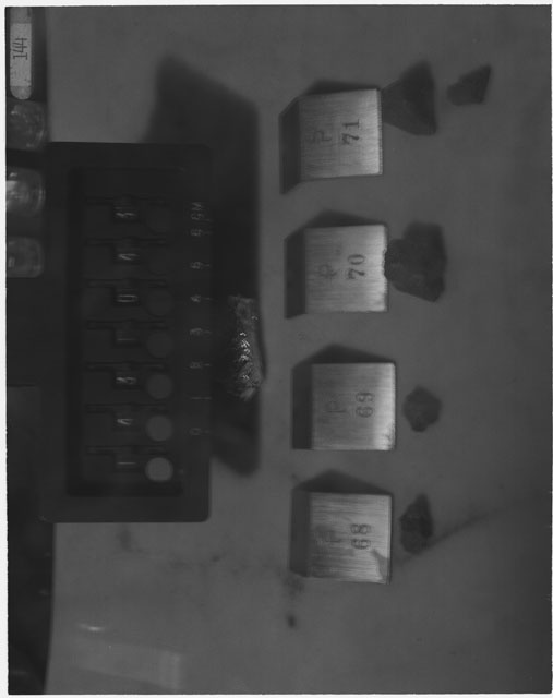 Black and white photograph of Apollo 14 Sample(s) 14310,68-71; Processing photograph displaying a post chipping sample group.