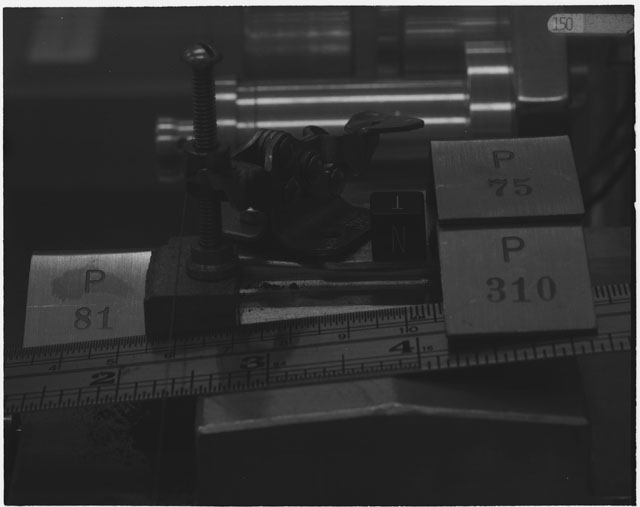 Black and white photograph of Apollo 14 Sample(s) 14310,75,81; Processing photograph displaying cutting with an orientation of T,N.
