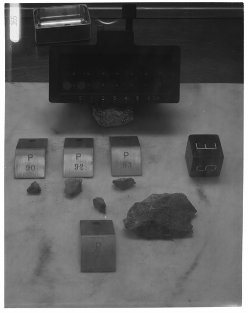 Black and white photograph of Apollo 14 Sample(s) 14310,37,90-93; Processing photograph displaying post chipping group with an orientation of E,S.