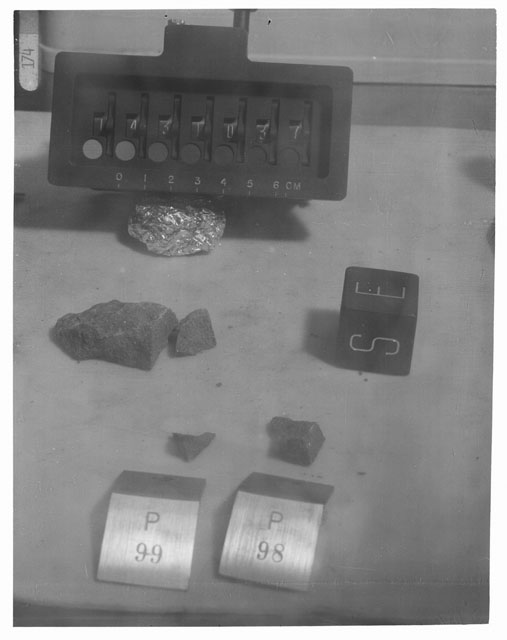 Black and white photograph of Apollo 14 Sample(s) 14310,37,98,99; Processing photograph displaying post chipping group with an orientation of E,S.