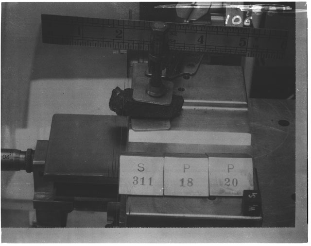 Black and white photograph of Apollo 14 Sample(s) 14311,18,20; Processing photograph displaying cutting with an orientation of W,S.