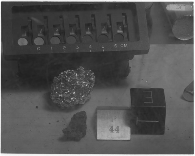Black and white photograph of Apollo 14 Sample(s) 14311,44; Processing photograph displaying post chip sample with an orientation of T,E.