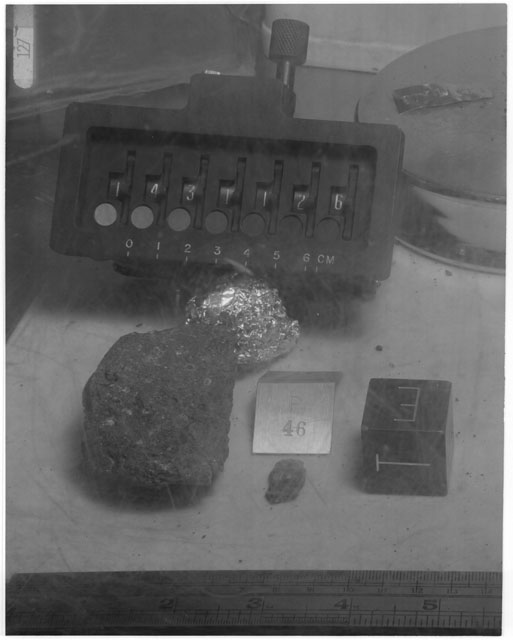 Black and white photograph of Apollo 14 Sample(s) 14311,26,46; Processing photograph displaying post chip sample with an orientation of T,E.
