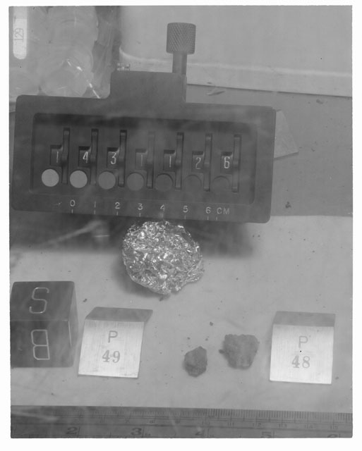 Black and white photograph of Apollo 14 Sample(s) 14311,26,49; Processing photograph displaying post chip sample with an orientation of B,S.