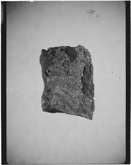 Black and white photograph of Apollo 14 Sample(s) 14311,42; Processing photograph displaying a chip.