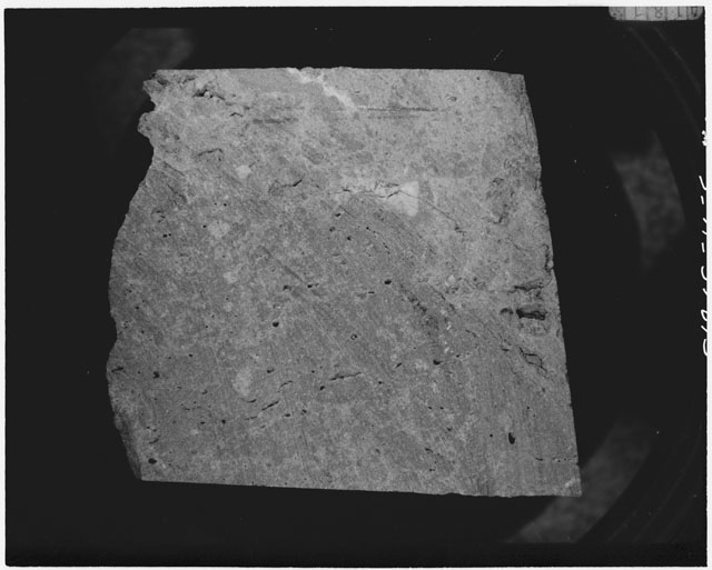 Black and white photograph of Apollo 14 Sample(s) 14311,54; Processing photograph displaying a chip.