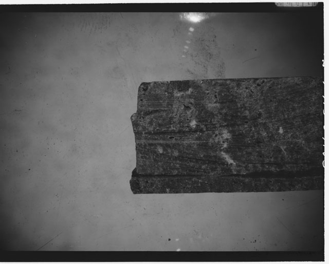 Black and white photograph of Apollo 14 Sample(s) 14311,51; Processing photograph displaying a slab.