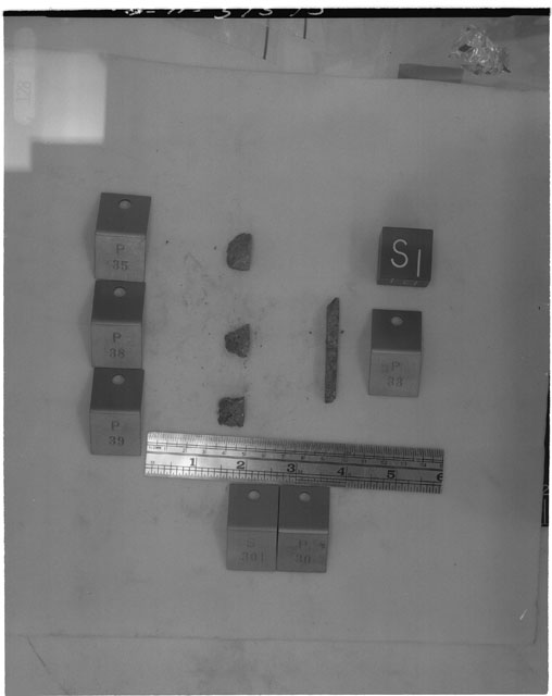 Black and white photograph of Apollo 14 Sample(s) 14301,30,33,35,38,39; Processing photograph displaying a post slabbing with an orientation of S.
